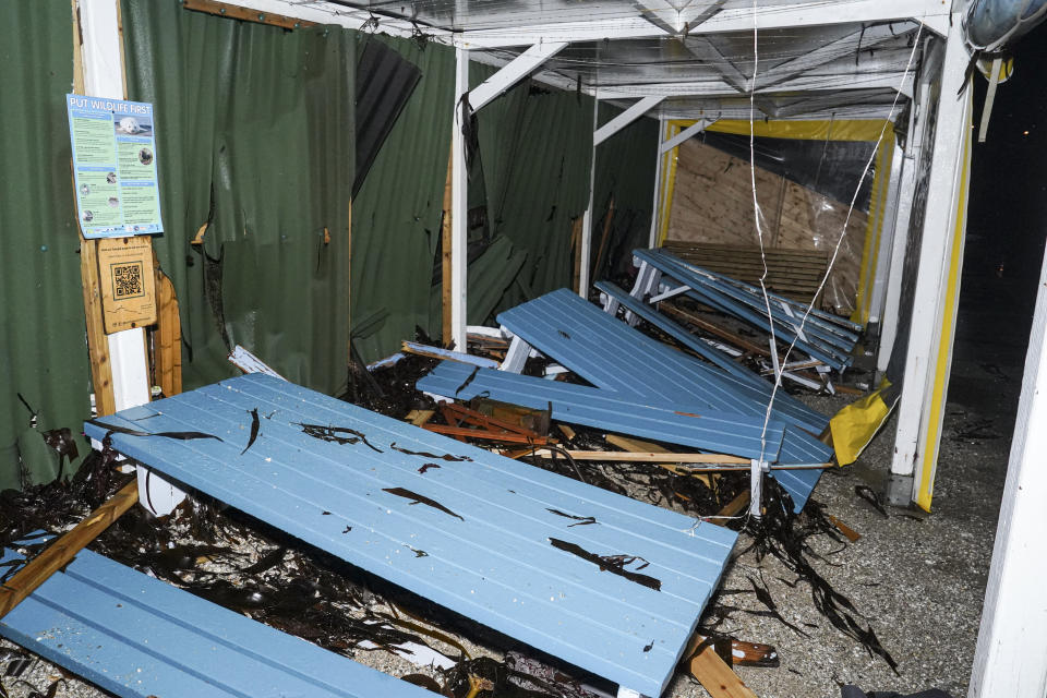 FALMOUTH, ENGLAND - APRIL 08: Debris of benches and tables inside the cafe at Castle Beach where three beach huts were swept into the sea on the evening high tide on April 08, 2024 in Falmouth, England. On Monday, the Met Office issued severe weather warnings for wind across the southern and western coasts of England and Wales, effective until Tuesday afternoon. This follows the turbulent weather over the weekend, when Storm Kathleen, combined with high tides, generated massive waves along the Cornish coast. (Photo by Hugh Hastings/Getty Images)