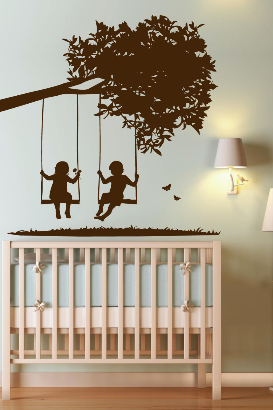 This undated publicity photo shows WALLTAT.com's "Kids on Swings" decal, a popular choice for parents decorating nurseries. Parents like the flexibility of wall decals that can be easily changed as kids grow. (AP Photo/Courtesy of WALLTAT.com)