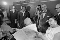 <p>Kennedy and Sen. Joseph Clark, in foreground with bow tie, tour a classroom in Greenville, Miss., April 11, 1967. (Photo: Jack Thornell/AP) </p>