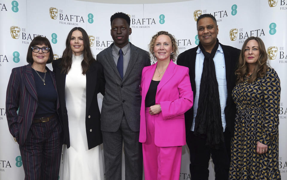 From left CEO of BAFTA Jane Millichip, actress Hayley Atwell, actor Toheeb Jimoh, Chair of BAFTA Film Committee Anna Higgs, Chair of BAFTA Krishnendu Majumdar and BAFTA Executive Director of Awards and Content Emma Baehr pose for a photo during the nominations for the BAFTA Film Awards 2023, at BAFTA's headquarters in London, Thursday, Jan. 19, 2023. (Yui Mok/PA via AP)