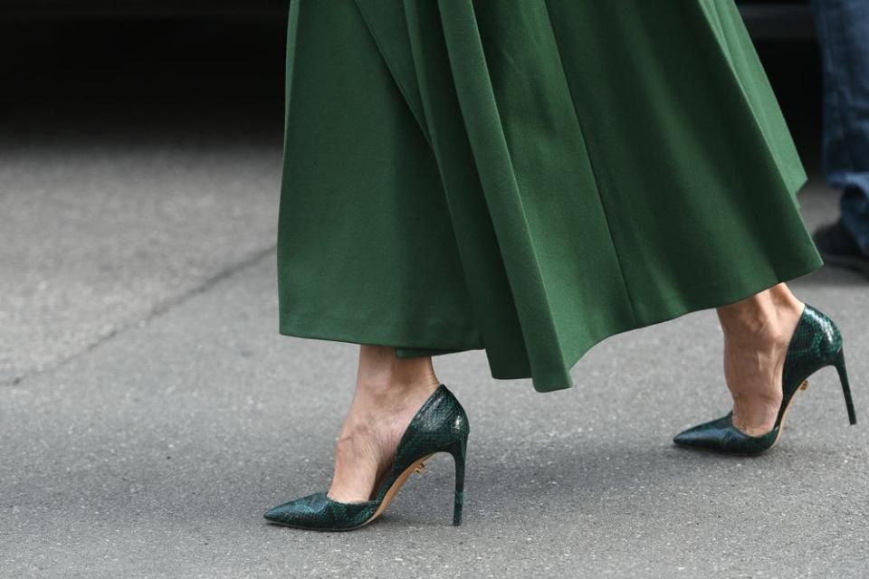 Dark green skirt and alligator heels