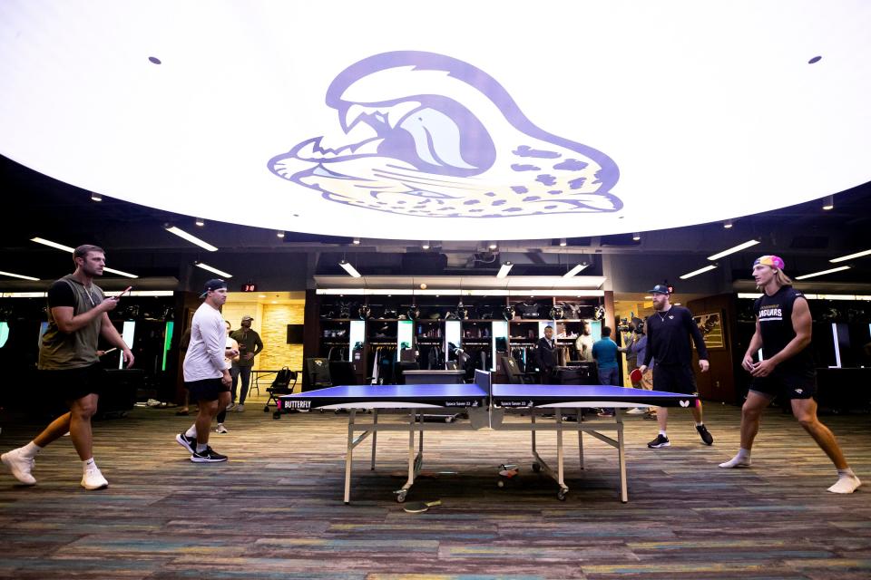 Jacksonville Jaguars starting quarterback Trevor Lawrence, right, and backup QB C.J. Beathard, play table tennis against long snapper Ross Matiscik and punter Logan Cooke in the team locker room after practice at TIAA Bank Field. (Kam Nedd/Jacksonville Jaguars)