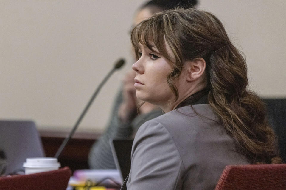 Hannah Gutierrez-Reed, the former armorer on the set of the movie "Rust," listens to Corporal Alexandra Hancock, with the Santa Fe Sheriff's Office, testify during Gutierrez-Reed's trial at district court in Santa Fe, N.M., on Wednesday, Feb. 28, 2024. (Luis Sánchez Saturno/Santa Fe New Mexican via AP, Pool)