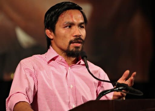 Manny Pacquiao addresses the media during the post-fight press conference after he was defeated by Timothy Bradley by split decision at MGM Grand Garden Arena in Las Vegas, Nevada