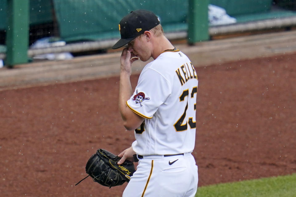 Pittsburgh Pirates starting pitcher Mitch Keller walks off the field after being removed during the third inning of a baseball game against the Los Angeles Dodgers in Pittsburgh, Thursday, June 10, 2021. (AP Photo/Gene J. Puskar)