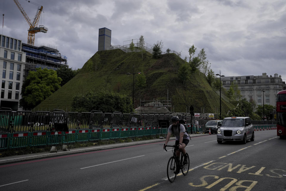 A view of the newly built "Marble Arch Mound" after it was opened to the public next to Marble Arch in London, Tuesday, July 27, 2021. The temporary installation commissioned by Westminster Council and designed by architects MVRDV has been opened as a visitor attraction to try and entice shoppers back to the adjacent Oxford Street after the coronavirus lockdowns. (AP Photo/Matt Dunham)