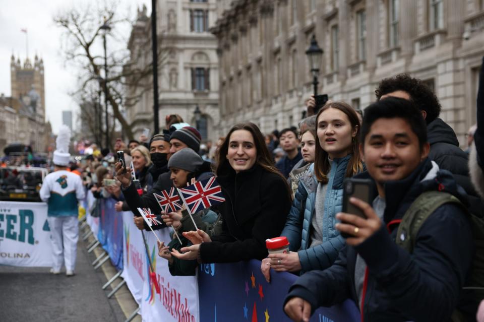 People line the streets to watch the parade (Getty Images)