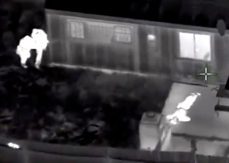 FILE PHOTO: Stephon Clark, 22, is visible on the ground after two police officers (L) shot him, in this still image captured from police aerial video footage released by Sacramento Police Department, California, U.S., on March 21, 2018. Courtesy Sacramento Police Department/Handout via REUTERS/File Photo
