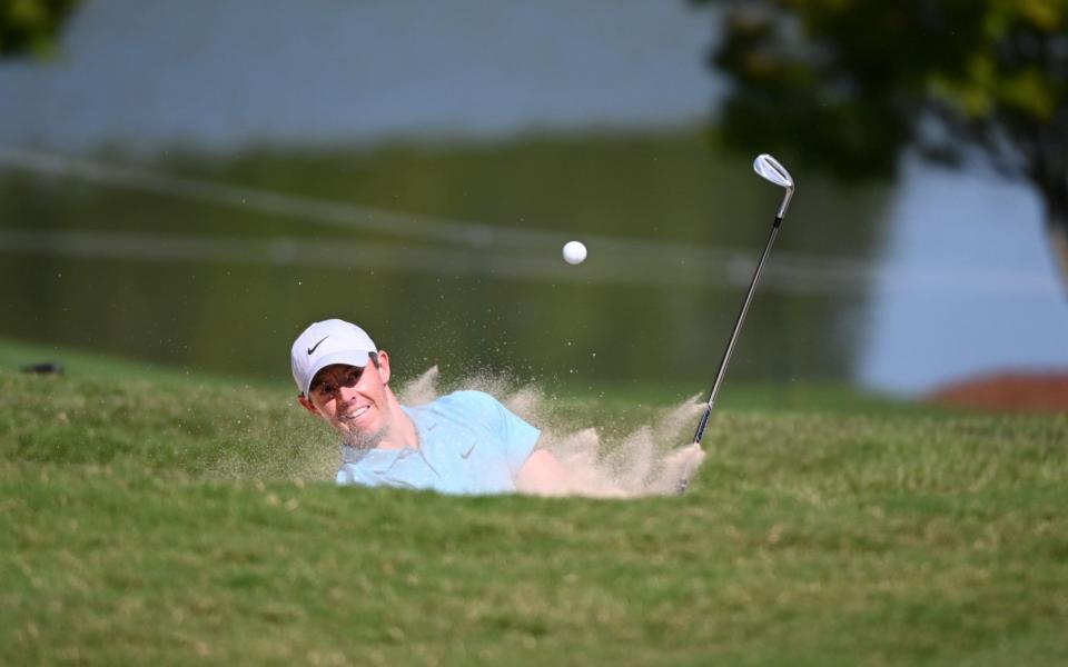 Rory McIlroy hits from a sand trap on the 9th green during the third round of the Tour Championship golf tournament at East Lake Golf Club -  USA TODAY Sports