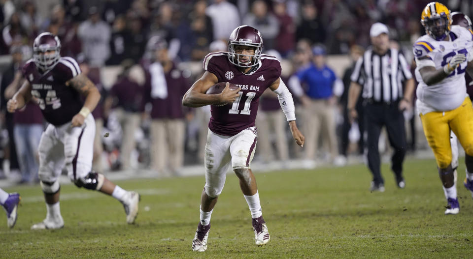 Texas A&M quarterback Kellen Mond (11) rushes for a gain during overtime of an NCAA college football game against LSU Saturday, Nov. 24, 2018, in College Station, Texas. Texas A&M won 74-72 in seven overtimes.(AP Photo/David J. Phillip)