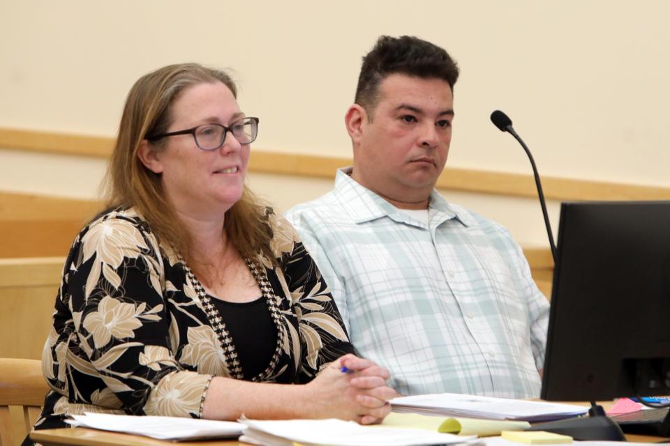 Raymond Canario and his attorney Stefani Jordan listen to the prosecution's opening statement on the first day of Canario's trial in Rockland County Court Feb. 27, 2023 in New City. Canario, a former building inspector, is charged with filing false documents concerning inspections for Spring Valley with the state of New York. One property included the Evergreen Court Home for Adults, where two people died in a blaze on March 22, 2021. 