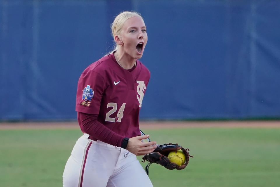 Florida State's Sydney Sherrill reacts after tagging out Oklahoma's Nicole Mendes at third base in the second inning Tuesday night.
