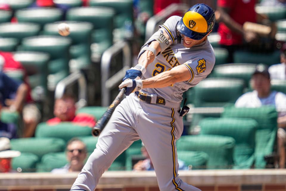 Brewers leftfielder Christian Yelich hits a home run against the Braves during the third inning at Truist Park on Sunday.