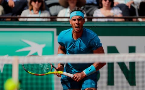 Spain's Rafael Nadal returns the ball to Argentina's Juan Martin del Potro during their men's singles semi-final match on day thirteen of The Roland Garros 2018 French Open tennis tournament in Paris on June 8, 2018