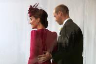 <p>Prince William sweetly touches Kate's back at <a href="https://www.townandcountrymag.com/society/tradition/g23322735/princess-eugenie-jack-brooksbank-royal-wedding-photos/" rel="nofollow noopener" target="_blank" data-ylk="slk:Princess Eugenie and Jack Brooksbank's wedding.;elm:context_link;itc:0;sec:content-canvas" class="link ">Princess Eugenie and Jack Brooksbank's wedding.</a><br></p>