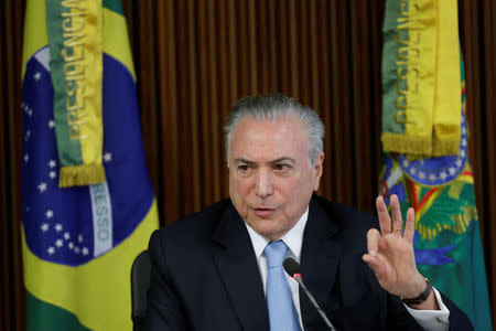 Brazil's president Michel Temer gestures during a meeting of the Pension Reform Commission at the Planalto Palace in Brasilia, Brazil, April 11, 2017. REUTERS/Ueslei Marcelino