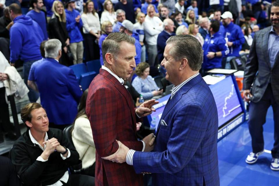 Alabama head coach Nate Oats, left, and Kentucky’s John Calipari speak before the game at Rupp Arena on Feb. 24. The Cats beat the Crimson Tide 117-95.