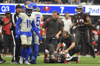 Tampa Bay Buccaneers tight end Rob Gronkowski (87) is attended after being hit by Los Angeles Rams linebacker Terrell Lewis during the second half of an NFL football game Sunday, Sept. 26, 2021, in Inglewood, Calif. (AP Photo/Kevork Djansezian)