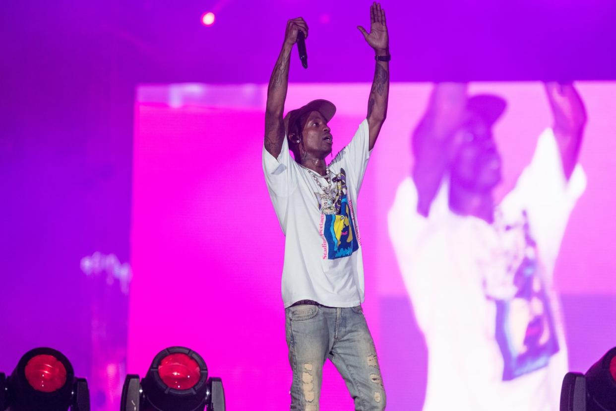 MIAMI GARDENS, FLORIDA - JULY 23: Rapper Travis Scott performs onstage during day two of Rolling Loud Miami 2022 at Hard Rock Stadium on July 23, 2022 in Miami Gardens, Florida. This marked Scott’s first major festival appearance since the Astroworld tragedy in 2021.(Photo by Jason Koerner/Getty Images)