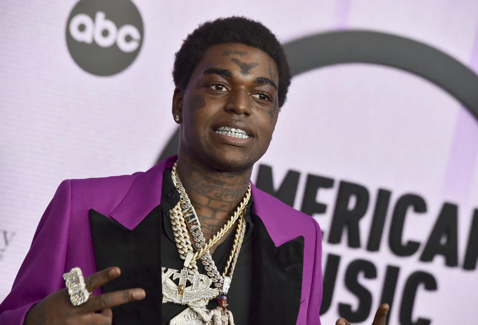 FILE - Kodak Black arrives at the American Music Awards on Nov. 20, 2022, at the Microsoft Theater in Los Angeles. A Florida judge issued an arrest warrant for the rapper, whose given name is Bill Kapri, on Thursday, Feb. 23, 2023, for failing a drug test while on bail for a drug charge, court records show. (Photo by Jordan Strauss/Invision/AP, File)