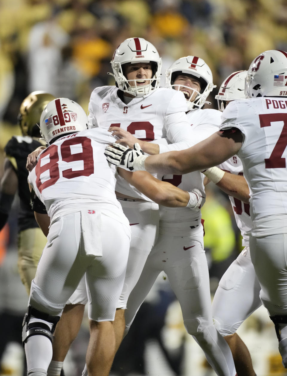 Stanford place kicker Joshua Karty, center, celebrates with teammates after kicking the winning field goal in overtime of an NCAA college football game against Colorado early Saturday, Oct. 14, 2023, in Boulder, Colo. (AP Photo/David Zalubowski)