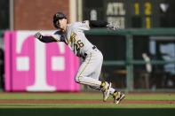 Pittsburgh Pirates' Adam Frazier runs to second base after a wild pitch by San Francisco Giants' Kevin Gausman during the first inning of a baseball game in San Francisco, Saturday, July 24, 2021. (AP Photo/Jeff Chiu)