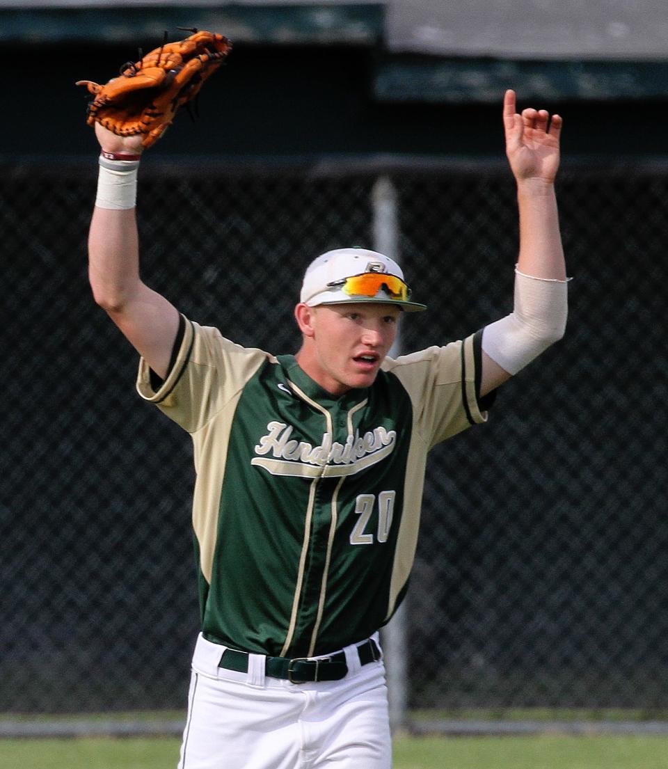 Hendricken center fielder Tucker Flint celebrates after catching the final out of the game against Coventry in June 2018.