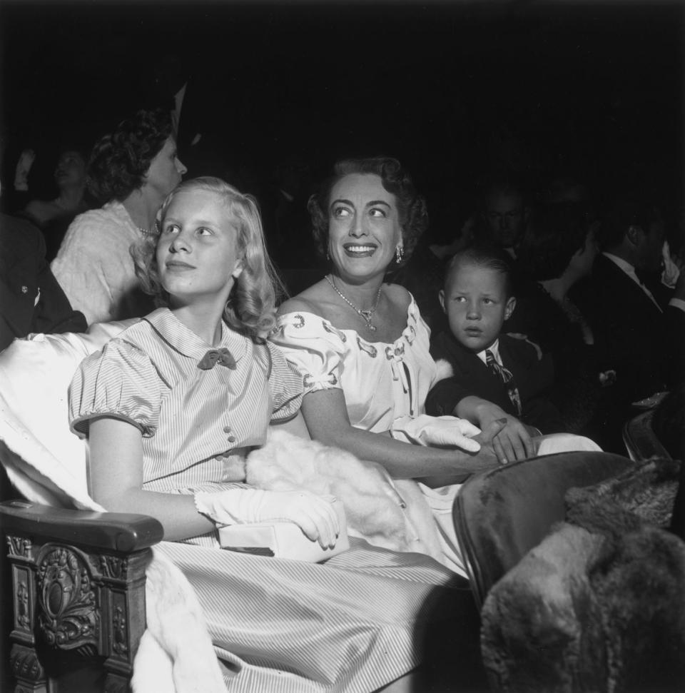 <p>Decked out in their Hollywood best, Christina and Christopher Crawford accompanied their mother to the premiere of <em>The Hasty Heart </em>in Los Angeles in 1949. Sounds like a fun family outing to us!</p>