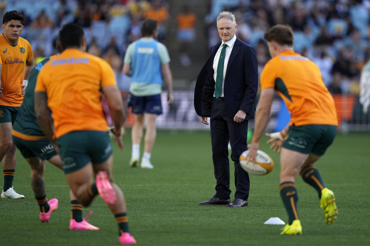 Australia's head coach Joe Schmidt watches his team warm up before playing New Zealand in their rugby union test match in Sydney, Saturday, Sept. 21, 2024. (AP Photo/Rick Rycroft)