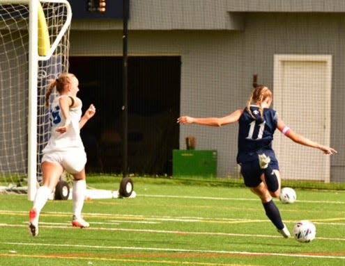 Kate Burrus, right, scored a goal and the St. Thomas Aquinas girls soccer team improved to 13-0-1 with Wednesday's 3-1 win over Fall Mountain.