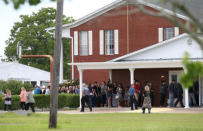 Family, friends and community members attend a visitation in remembrance of Aaron Kyle McCleod, one of the victims killed in a shooting at Santa Fe High School, at Hayes Funeral Home in Hitchcock, Texas, U.S., May 24, 2018. REUTERS/Loren Elliott