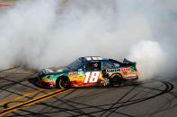 TALLADEGA, AL - MAY 05: Joey Logano, driver of the #18 GameStop Toyota, burns out to celebrate winning the NASCAR Nationwide Series Aaron's 312 at Talladega Superspeedway on May 5, 2012 in Talladega, Alabama. (Photo by Jared C. Tilton/Getty Images)