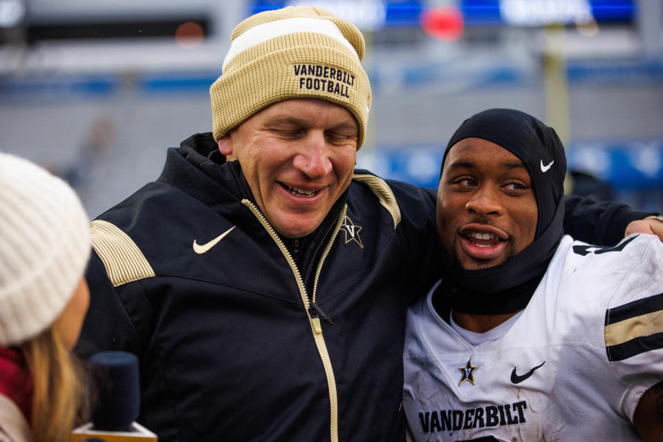 Nov 12, 2022; Lexington, Kentucky, USA; Vanderbilt Commodores running back Ray Davis (2) hugs head coach Clark Lea after the game against the Kentucky Wildcats at Kroger Field. Mandatory Credit: Jordan Prather-USA TODAY Sports