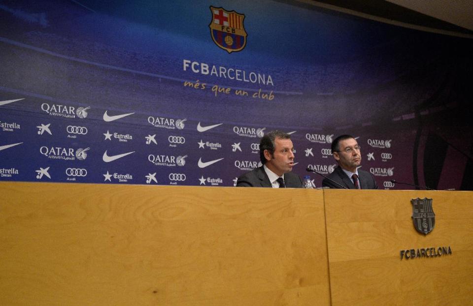 FC Barcelona's President Sandro Rosell, left, and Vice-president Josep Maria Bartomeu, attend a press conference at the Camp Nou stadium in Barcelona, Spain, Thursday, Jan 23, 2014. Sandro Rosell is stepping down as president of Barcelona a day after a judge agreed to hear a lawsuit accusing him of allegedly hiding the cost of the transfer of Brazil striker Neymar. Rosell says he is resigning after an emergency meeting with Barcelona's board of directors on Thursday. Rosell says vice president Josep Bartomeu will take his place as president and finish the term that expires in 2016. Elected in 2010 to replace outgoing president Joan Laporta, Rosell said last April he planned to run for re-election in 2016. (AP Photo/Manu Fernandez)
