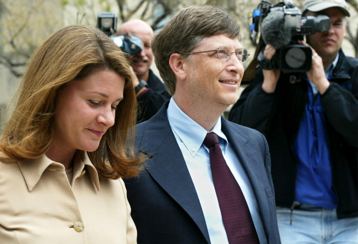404302 04: Microsoft Corp. Chairman Bill Gates arrives at U.S. District Court with his wife Melinda April 22, 2002 in Washington, DC. Gates is taking the witness stand to give his first live testimony since the antitrust case was filed against the software giant in 1998. (Photo by Alex Wong/Getty Images)