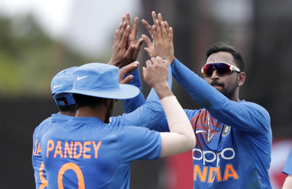 India's Krunal Panda, right, celebrates with India's Manish Pandey, left, after Pandey caught West Indies' Nicholas Pooran during the second Twenty20 international cricket match, Sunday, Aug. 4, 2019, in Lauderhill, Fla. (AP Photo/Lynne Sladky)