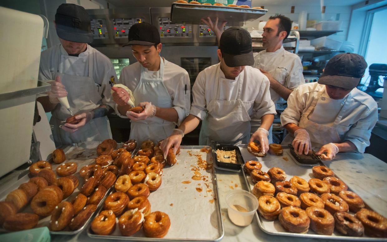 A baking crew making cronuts at the Dominique Ansel Bakery in New York