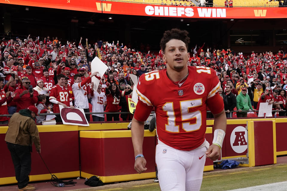 Kansas City Chiefs quarterback Patrick Mahomes runs off the field after an NFL football game against the Denver Broncos Sunday, Jan. 1, 2023, in Kansas City, Mo. (AP Photo/Charlie Riedel)