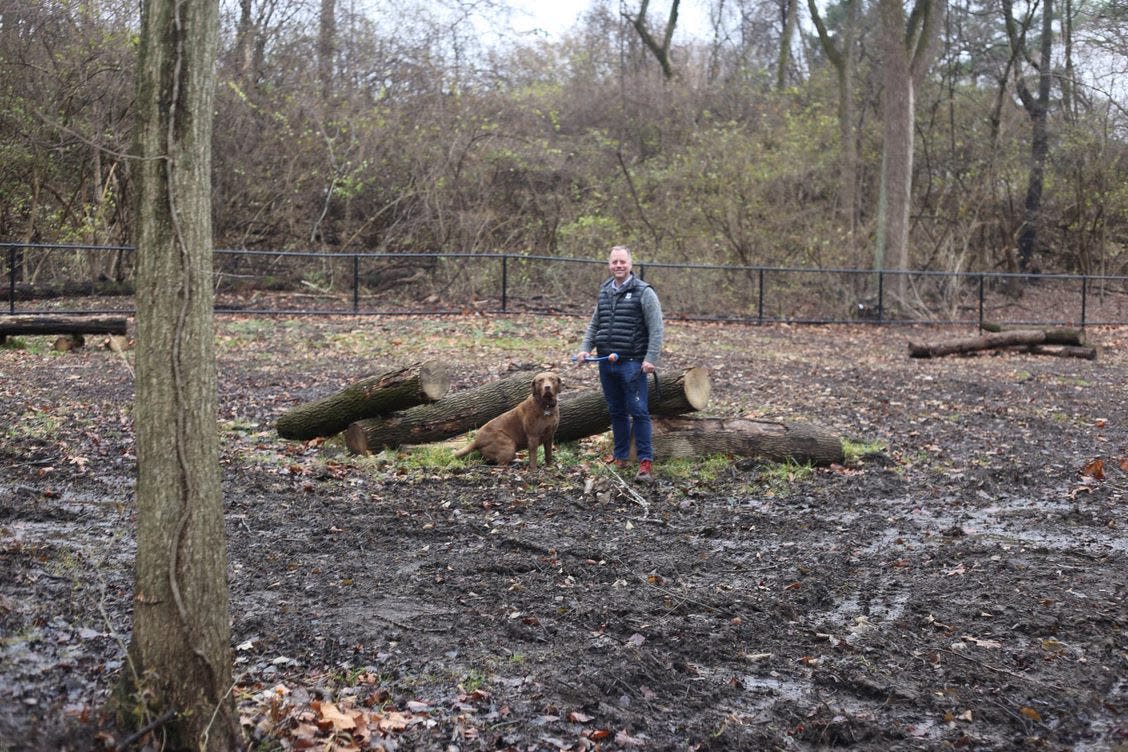 Bexley Mayor Ben Kessler with his dog, Oban, visits the site of the new Bexley Natural Dog Park at Schneider Park, which is scheduled to open in spring.