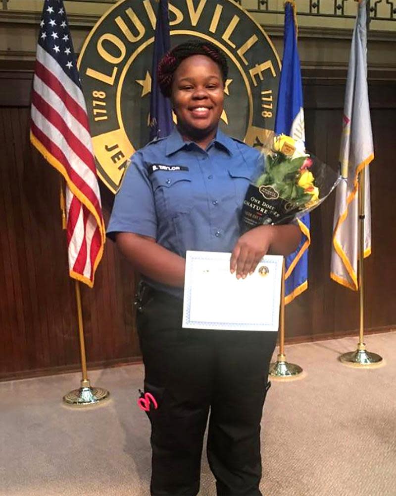 Breonna Taylor poses during a graduation ceremony in Louisville, Kentucky, in an undated photo.