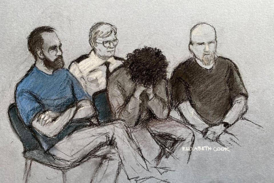 Drawing by a court artist of 17-year-old Axel Rudakubana (centre) covering his face (PA Wire)