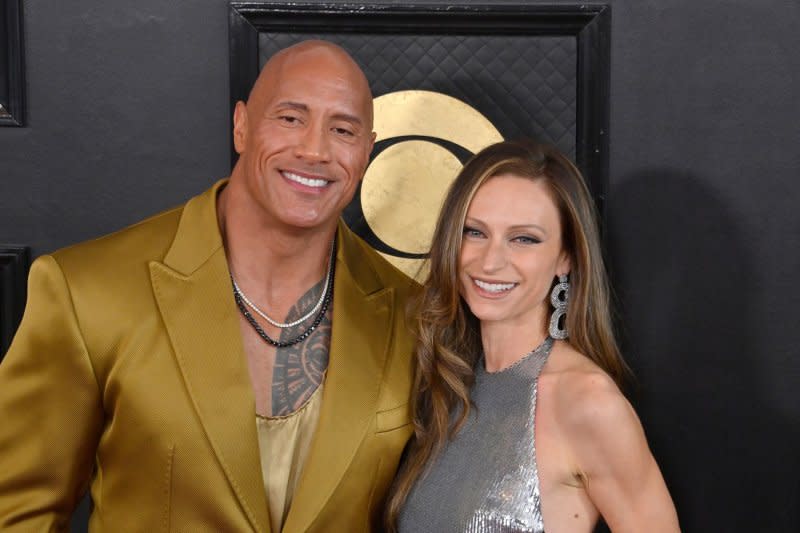 Dwayne Johnson (L) and Lauren Hashian attend the Grammy Awards in February. File Photo by Jim Ruymen/UPI