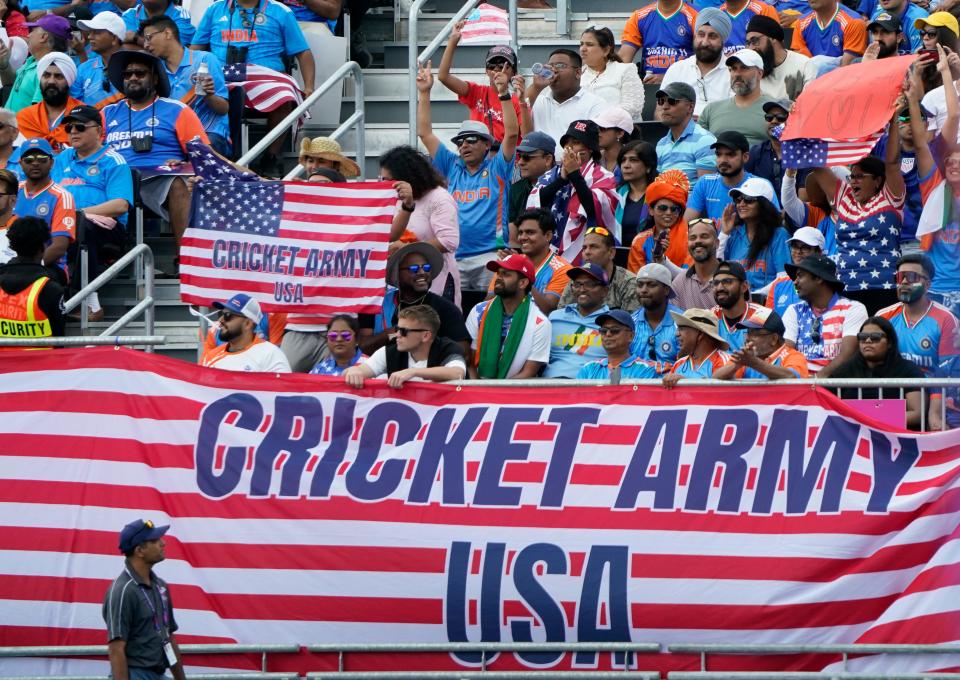 USA fans cheer during the ICC men's Twenty20 World Cup 2024 group A cricket match between the USA and India at Nassau County International Cricket Stadium in East Meadow, New York on June 12, 2024.