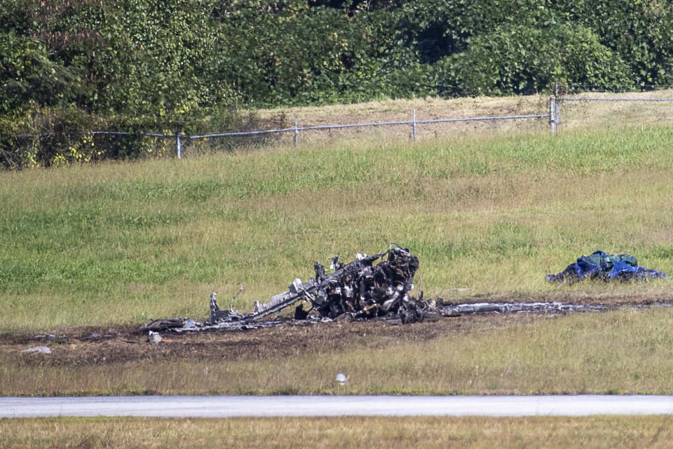 Emergency Response teams work the scene of a fatal small plane crash at DeKalb-Peachtree Airport, Friday, Oct. 8, 2021, in DeKalb County, Ga. (Alyssa Pointer/Atlanta Journal-Constitution via AP)