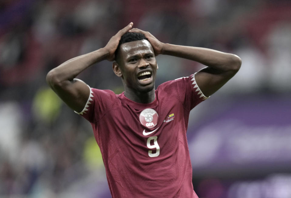 FILE - Qatar's Mohammed Muntari reacts after missing a chance to score during the World Cup, group A soccer match between Qatar and Ecuador at the Al Bayt Stadium in Al Khor, Sunday, Nov. 20, 2022. (AP Photo/Ariel Schalit, File)