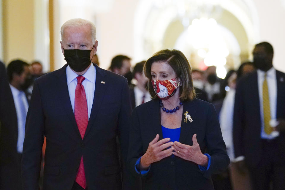 President Joe Biden walks with House Speaker Nancy Pelosi of Calif., on Capitol Hill in Washington, Friday, Oct. 1, 2021, after attending a meeting with the House Democratic caucus to try to resolve an impasse around the bipartisan infrastructure bill. (AP Photo/Susan Walsh)