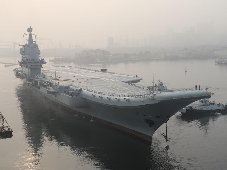 China's first domestically manufactured aircraft carrier, known only as "Type 001A", leaves port in the northeast city of Dalian early on May 13, 2018.