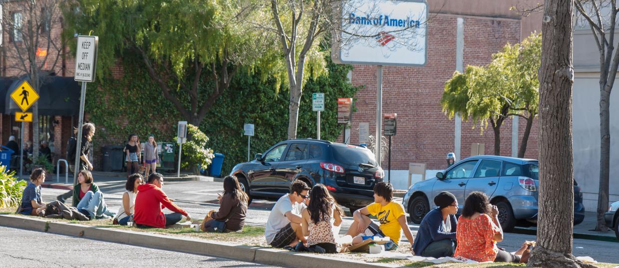 Berkeley diners feast on takeout on a highway median, a popular spot for picnics.