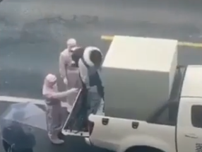 The metal box on the back of a pick-up truck used to transport a suspected coronavirus victim to a designated quarantine area: Twitter