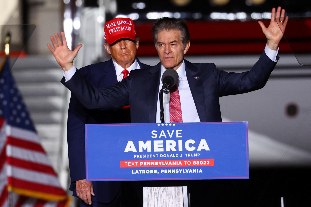 Former President Donald Trump looks on as Pennsylvania Republican Senate candidate Mehmet Oz speaks at a rally in Latrobe, Pa., on Saturday.